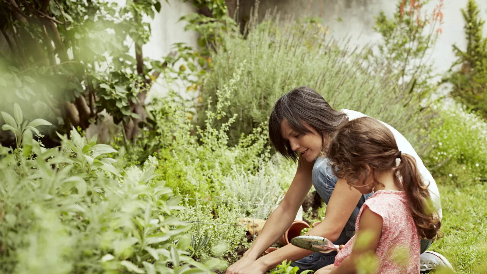 a woman with her daughter in the garden