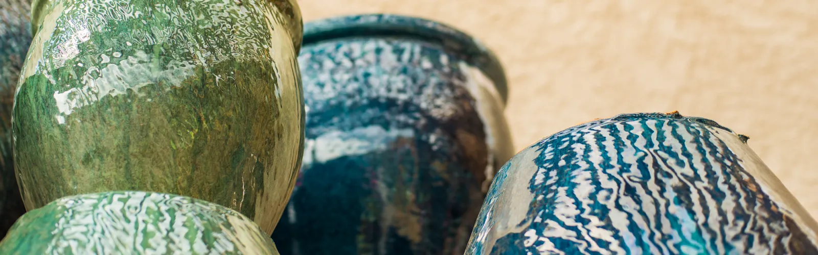 a colorful vase sitting on a table